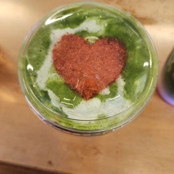 Iced matcha with a cocoa heart