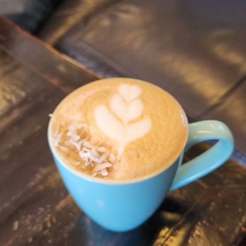 Latte art in a blue cup